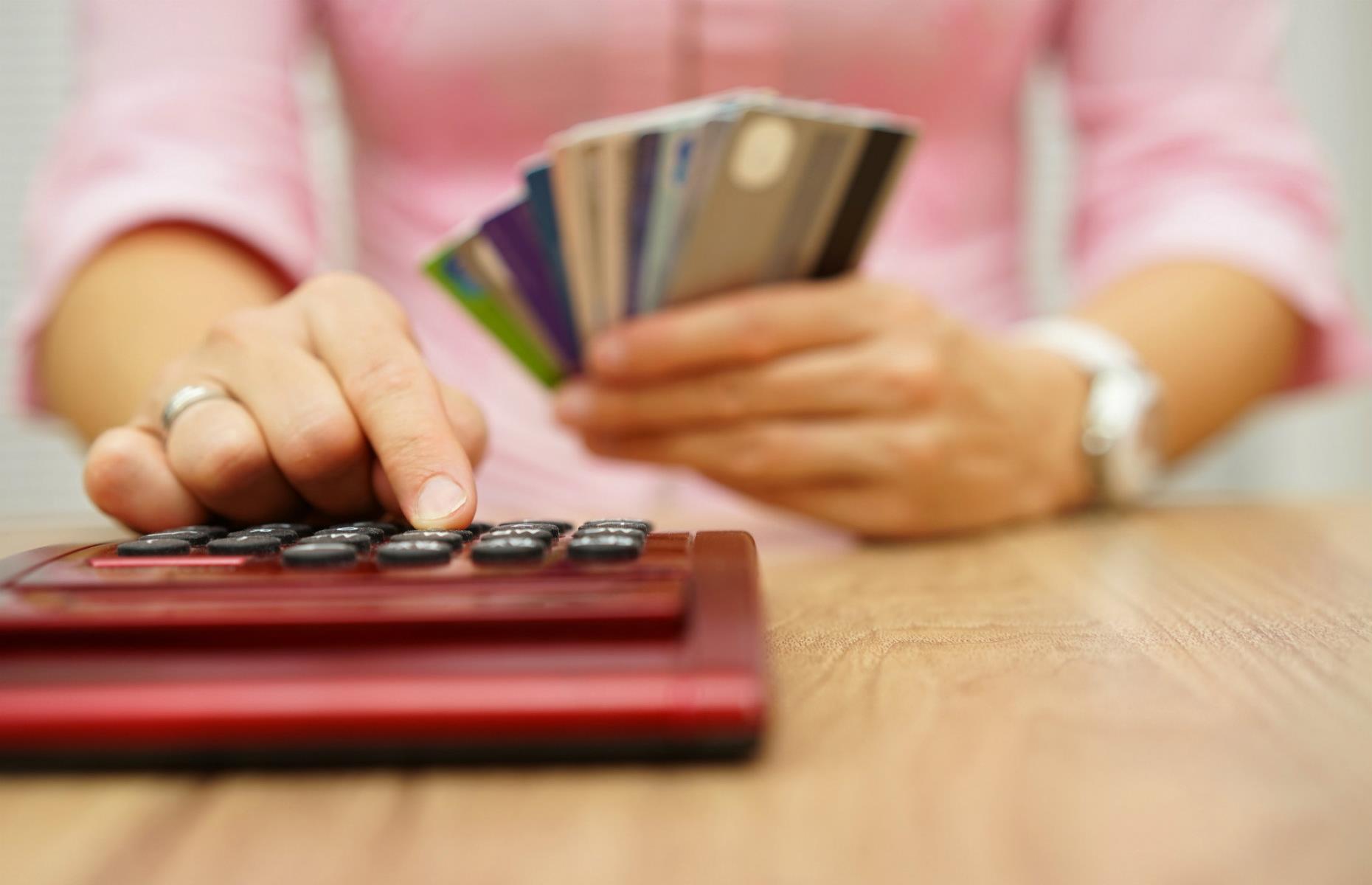 Woman cards and calculator
